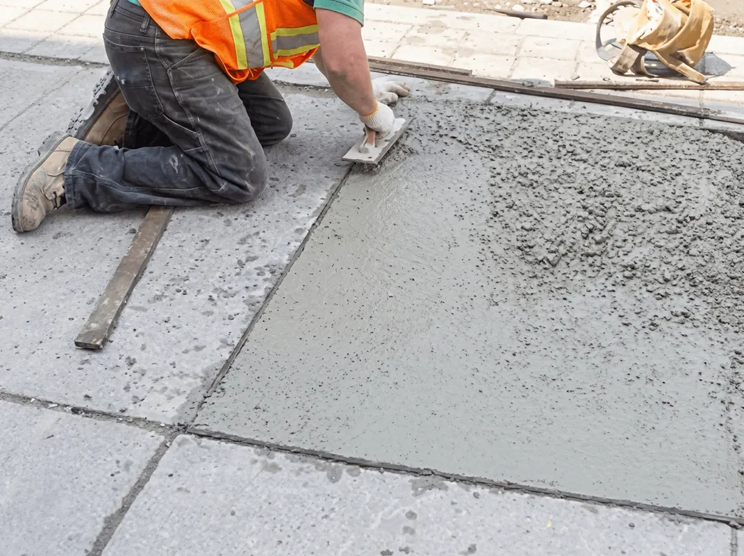 Professional repairing a concrete floor in Stamford, CT