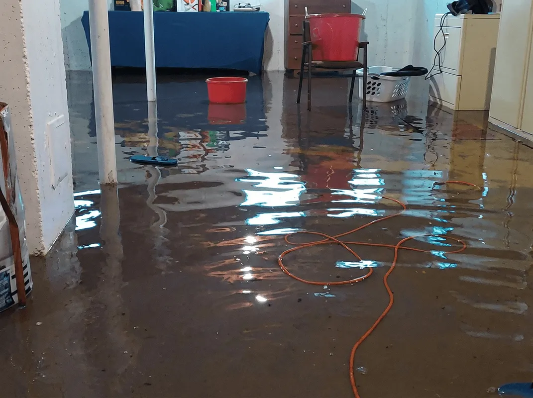 Basement with boiler, cabinets and washing machine completely flooded in Stamford, CT